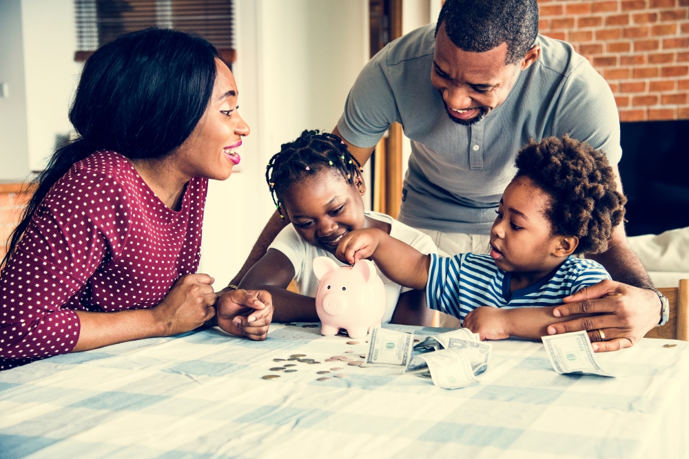 Happy family with papers on table