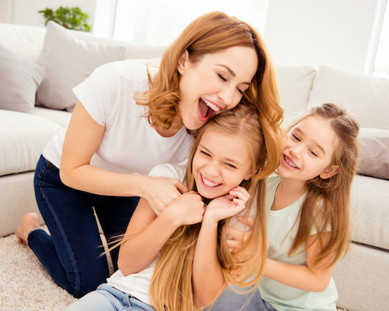 woman playing with her children