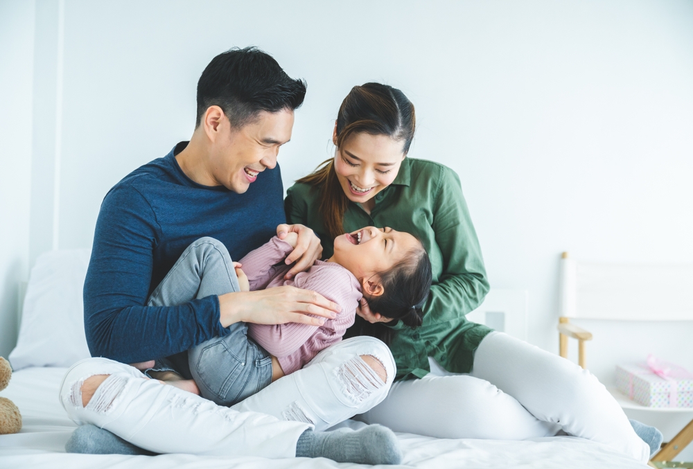 Happy Family Laughing Together