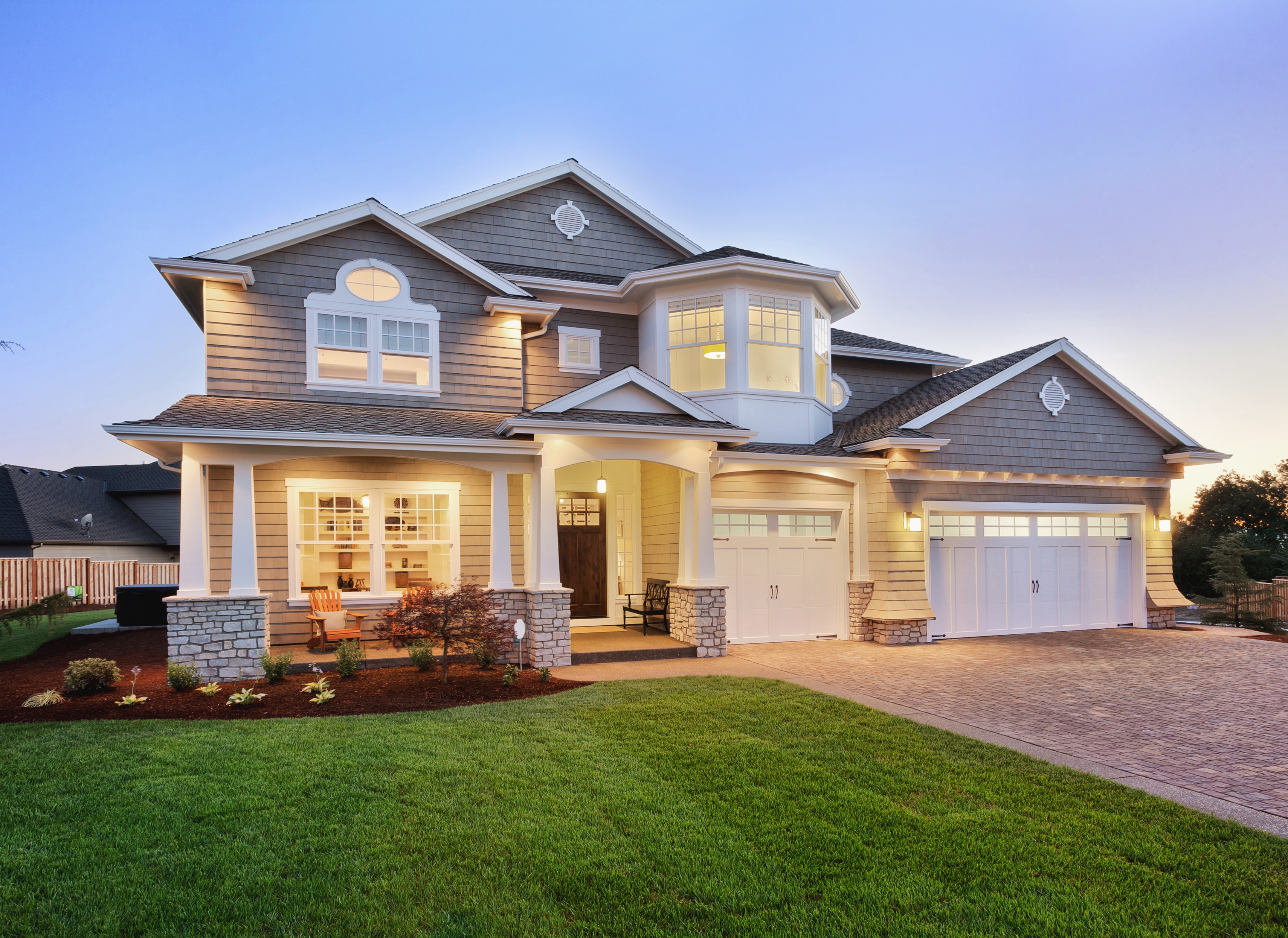 Home Exterior At Night With The Lights On