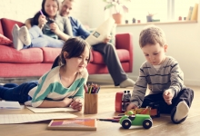 happy, healthy family in living room at home 