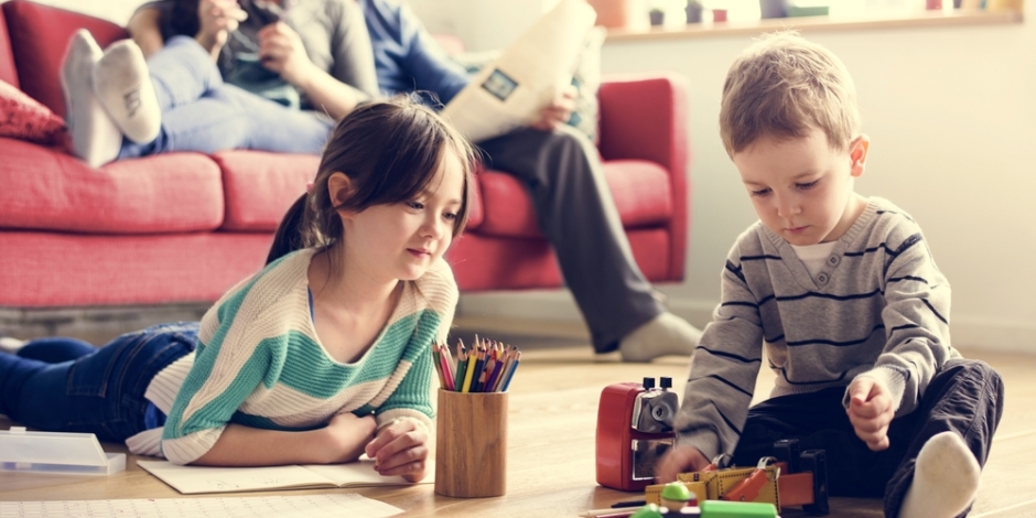 happy, healthy family in living room at home 