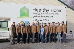 HHEC team in front of truck with brown jackets